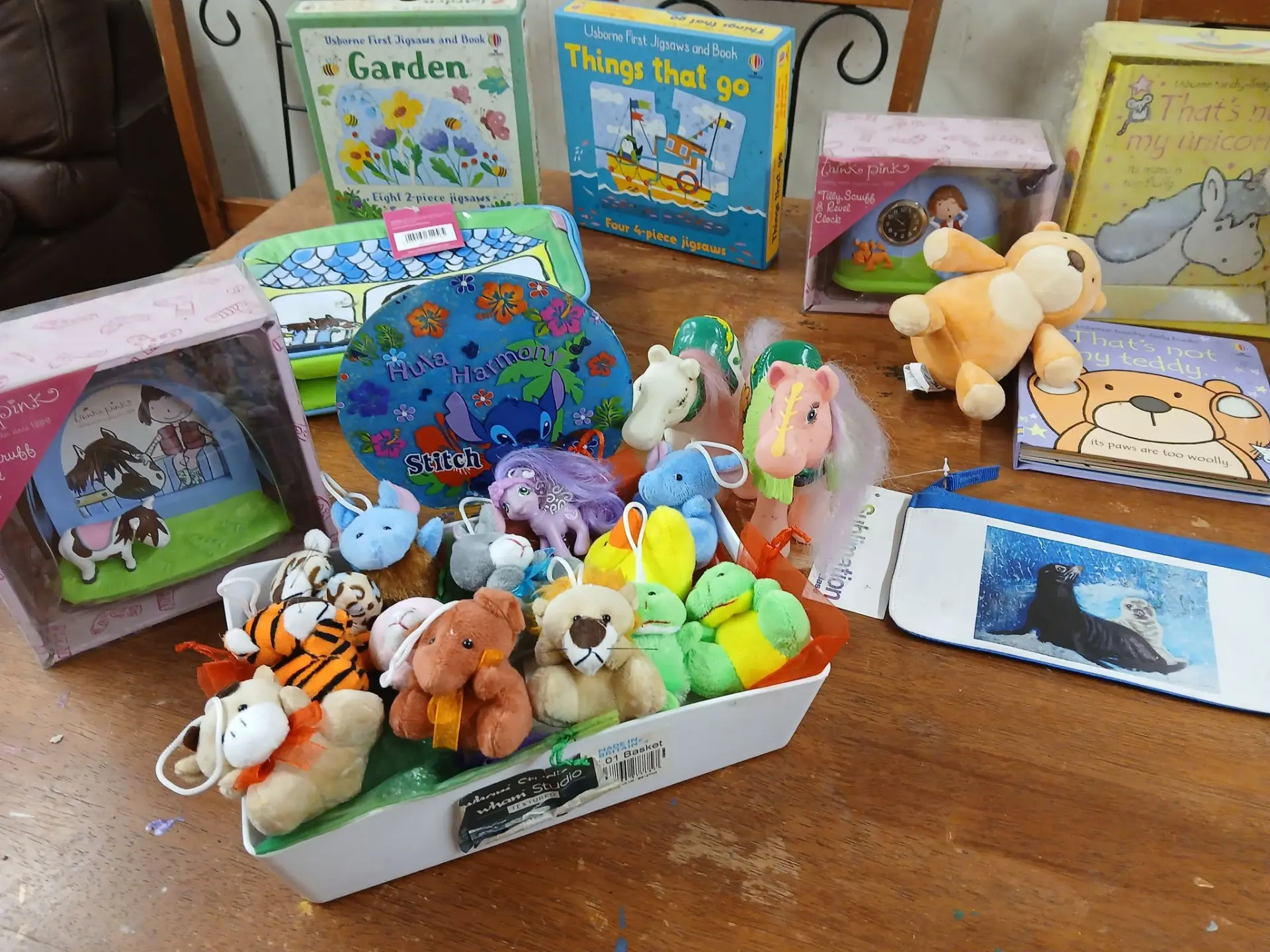 Books, jigsaws and soft toys set out for craft and quiet time